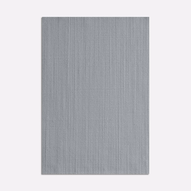 Cool pale blue-grey Tatin Cielo textile with a fine vertical woven texture