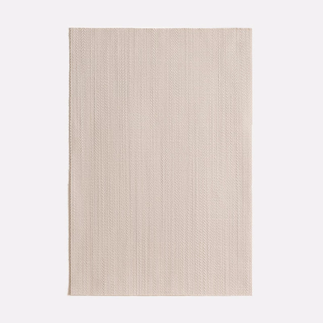 Pale mastice swatch with fine vertical ribbing and a softly warm grey-beige tone