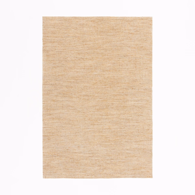 Warm peanut sheer textile with fine horizontal slub texture in close-up