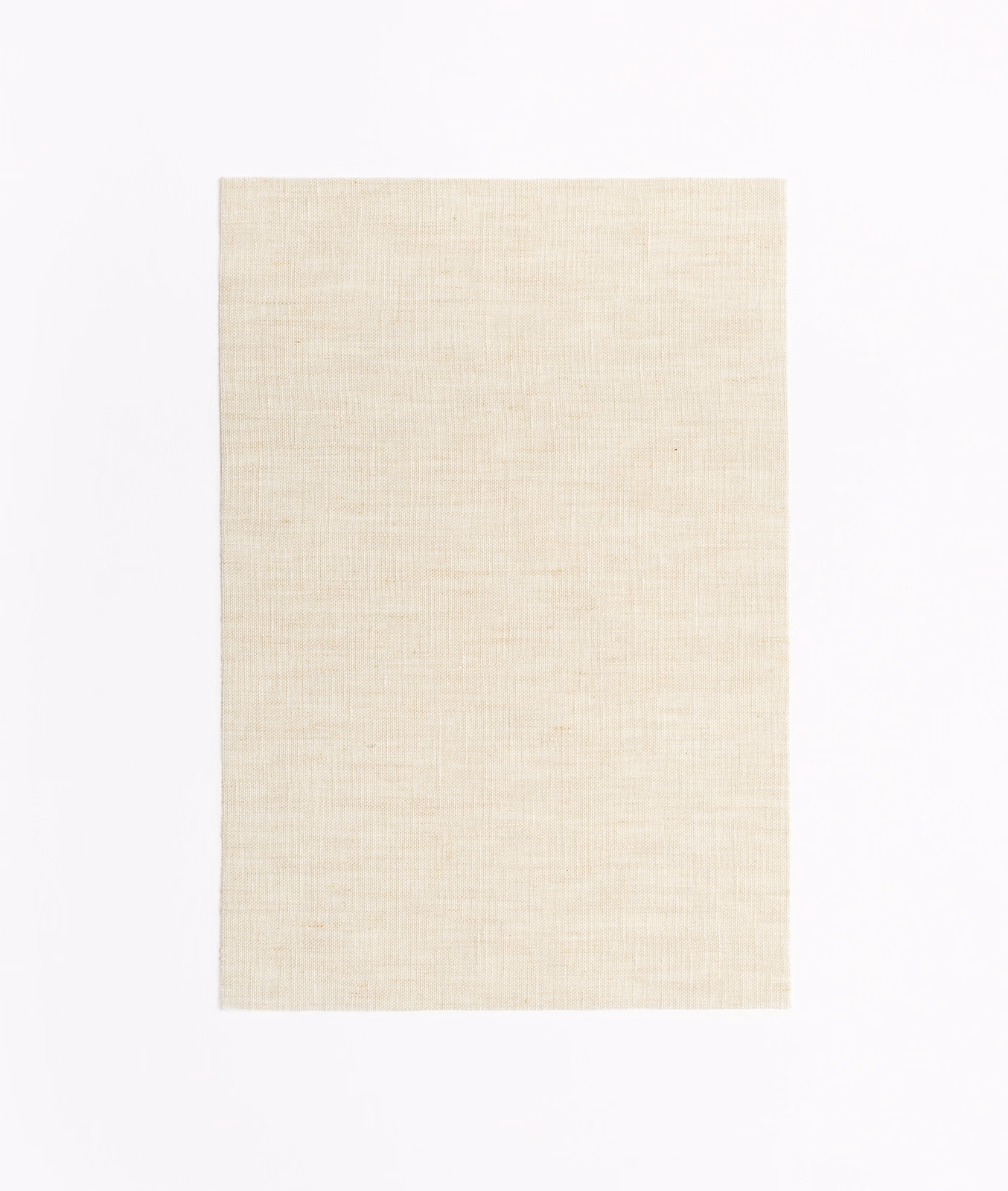 Warm ivory Acquerello Sand swatch with fine, softly irregular sand-toned woven texture