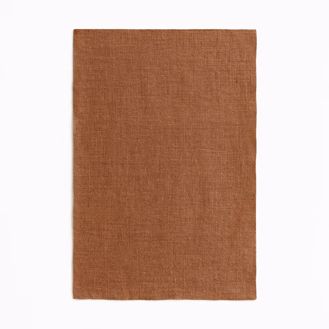 Warm canyon terracotta sheer with a fine, softly irregular woven surface