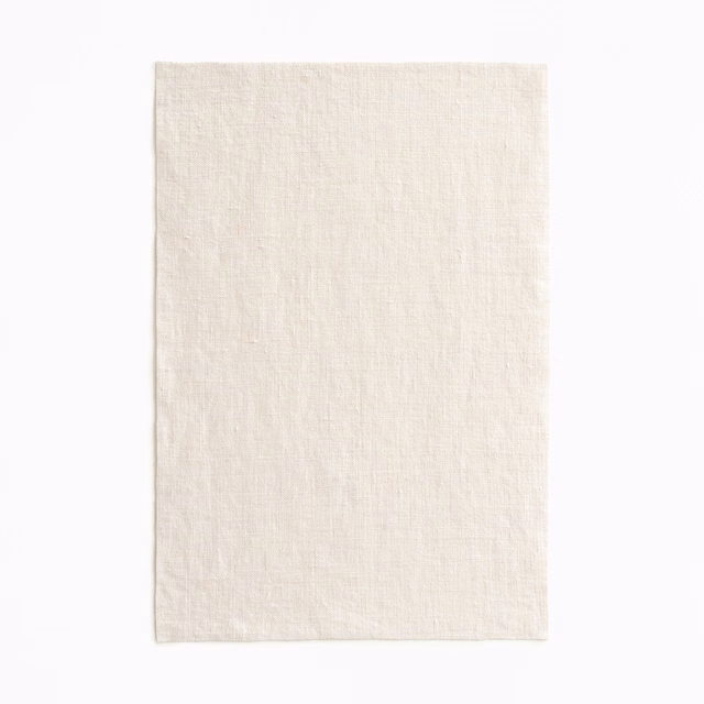 Pale ecru sheer swatch with a fine, softly irregular woven texture