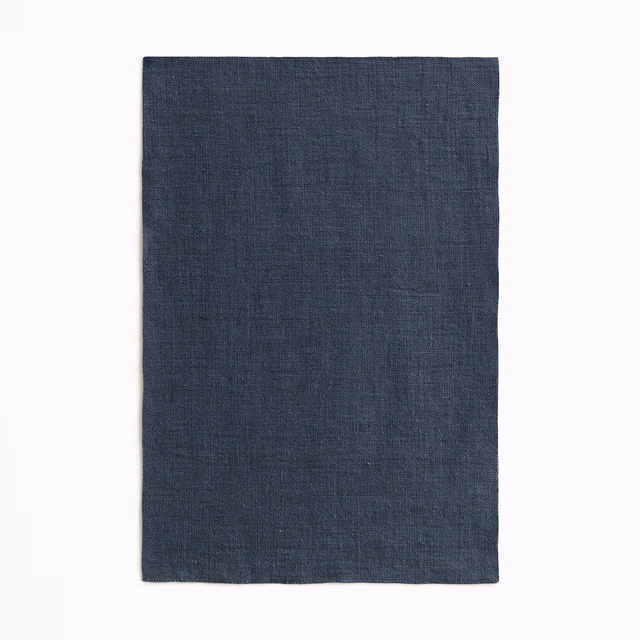 Deep indigo-blue sheer cloth with a fine, subtly crosshatched woven texture