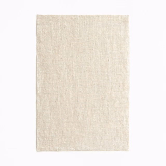 Pale natural ivory sheer weave with subtle vertical slubs and soft textural variation