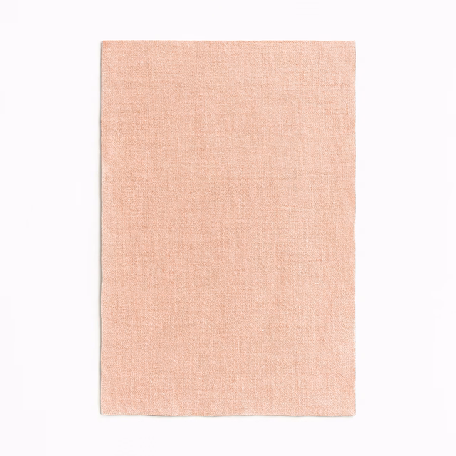Pale blush nude sheer textile with a subtly irregular fine plain weave