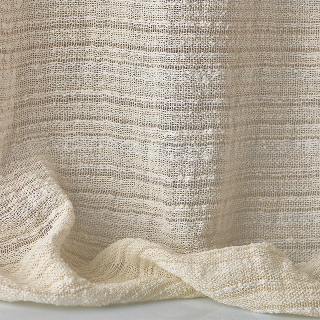 Warm ivory sheer weave with open horizontal slubs and softly translucent folds