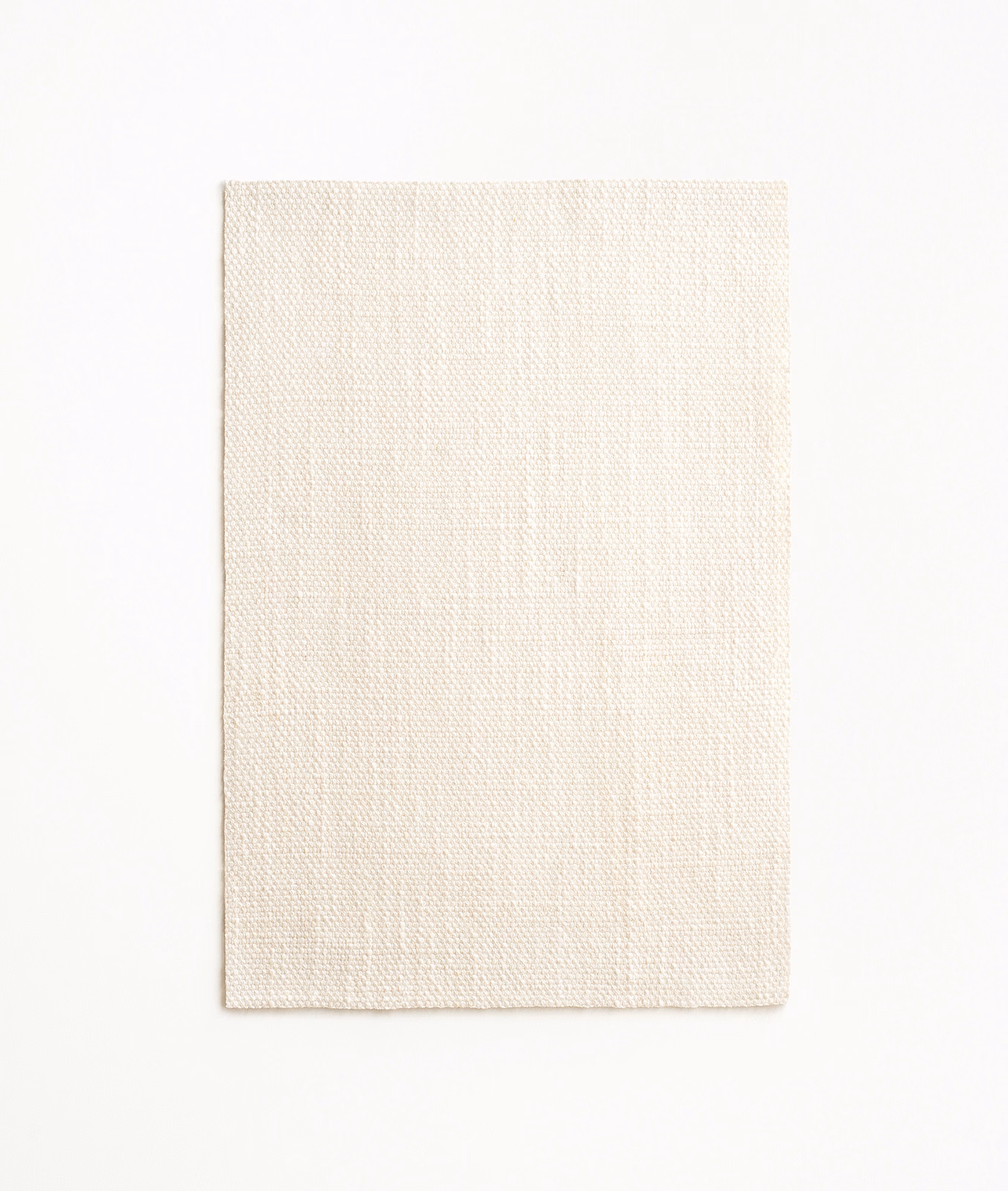 Warm ivory sheer fabric swatch with a fine, subtly vertical woven texture