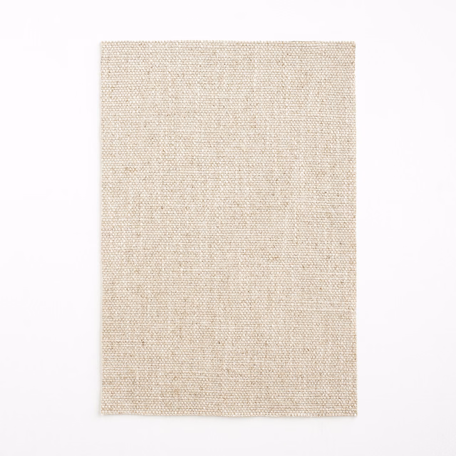 Close-up of pale natural-beige plain weave with subtle linen-like flecks