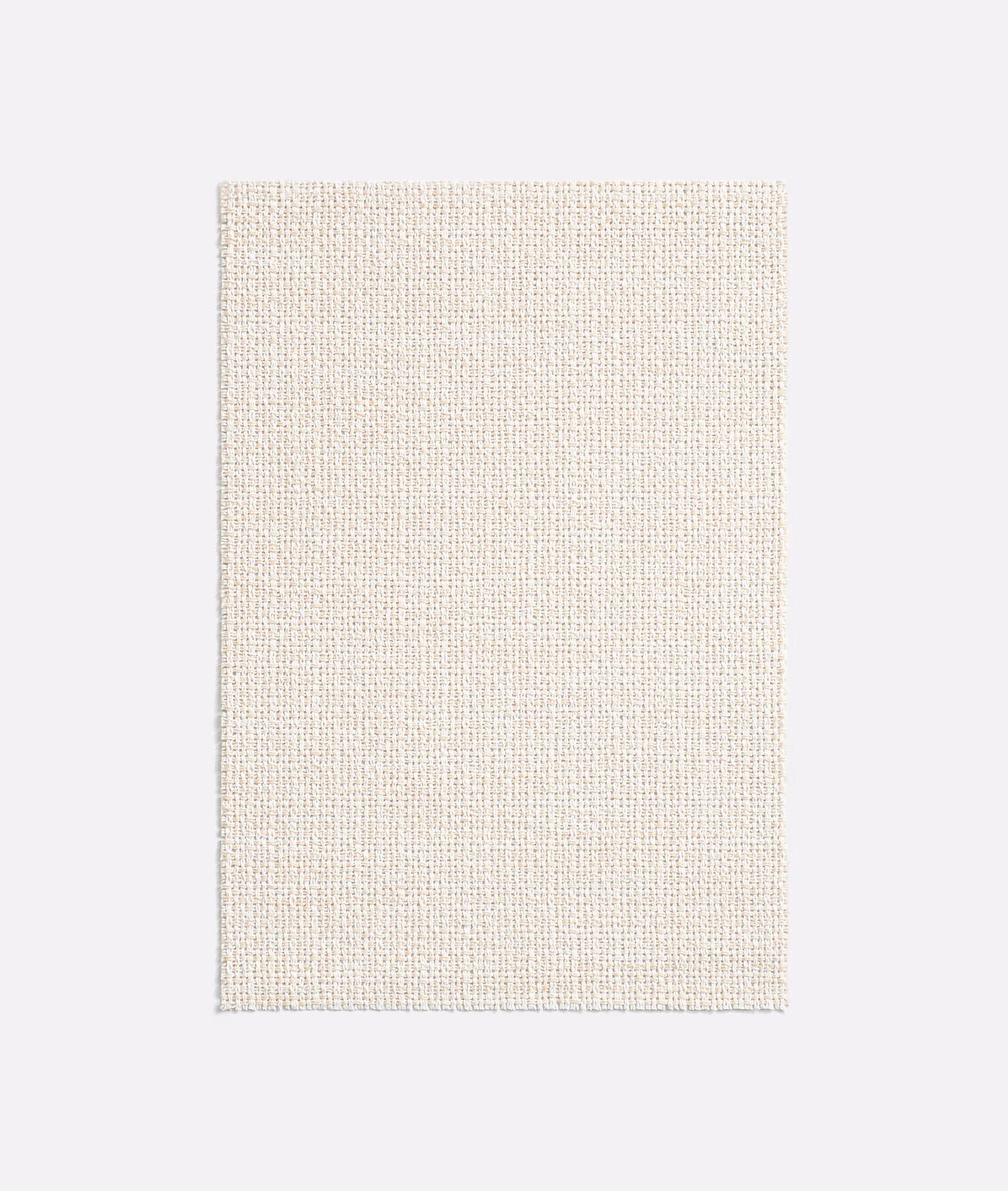 Close view of warm ivory open-weave textile with finely grained texture