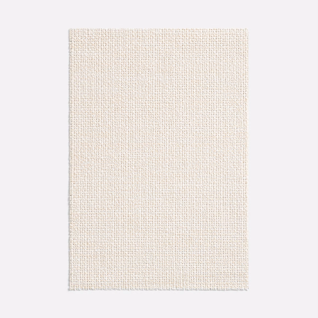 Close view of warm ivory open-weave textile with finely grained texture