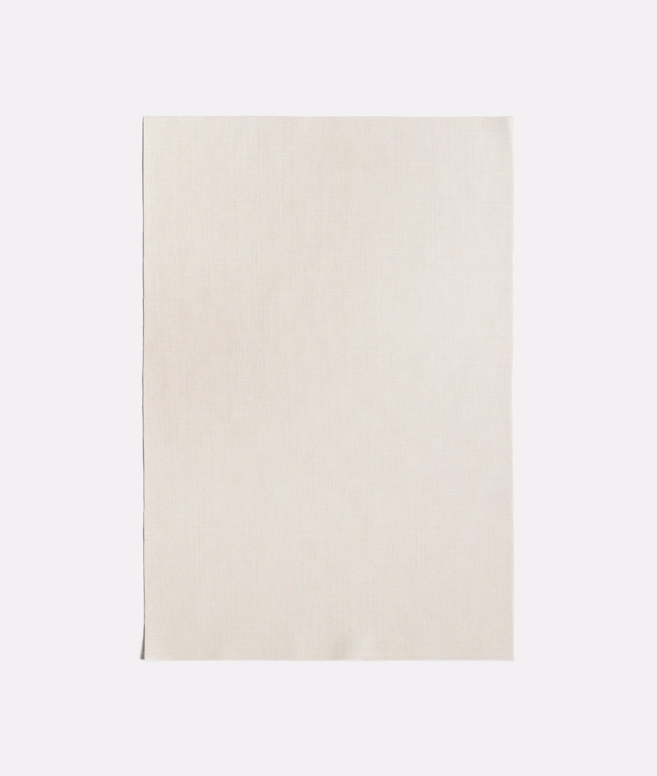 Close view of softly woven ivory-beige sheer fabric with subtle vertical texture
