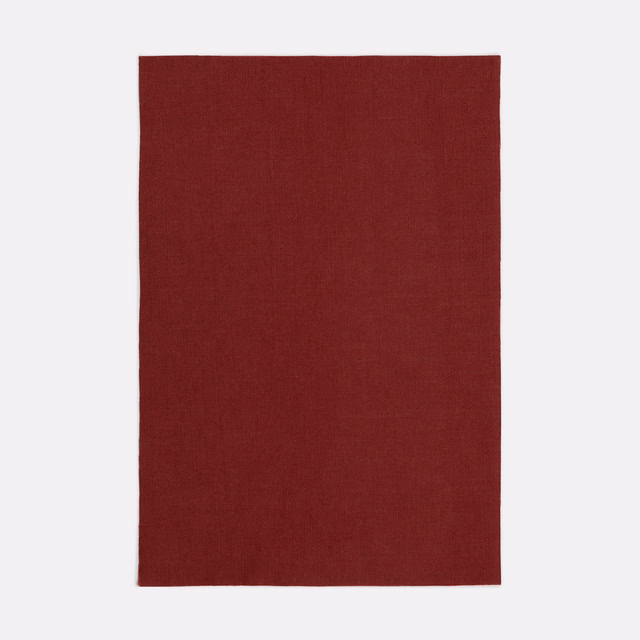 Deep oxblood-red sheer fabric swatch with a subtle fine woven texture