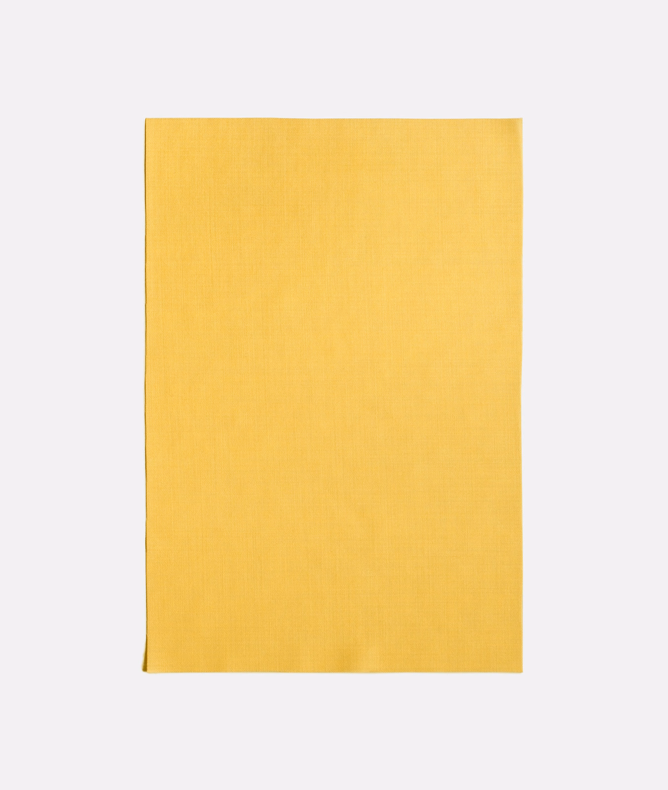 Warm saffron-yellow sheer fabric with a fine, subtly mottled woven texture