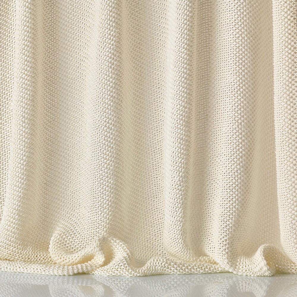 Warm ivory-cream sheer mesh with vertical folds and a softly rippled hem