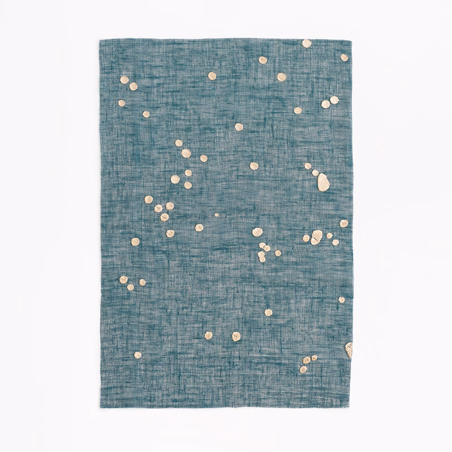 Teal-blue crosshatched sheer with scattered ivory confetti spots in varied sizes