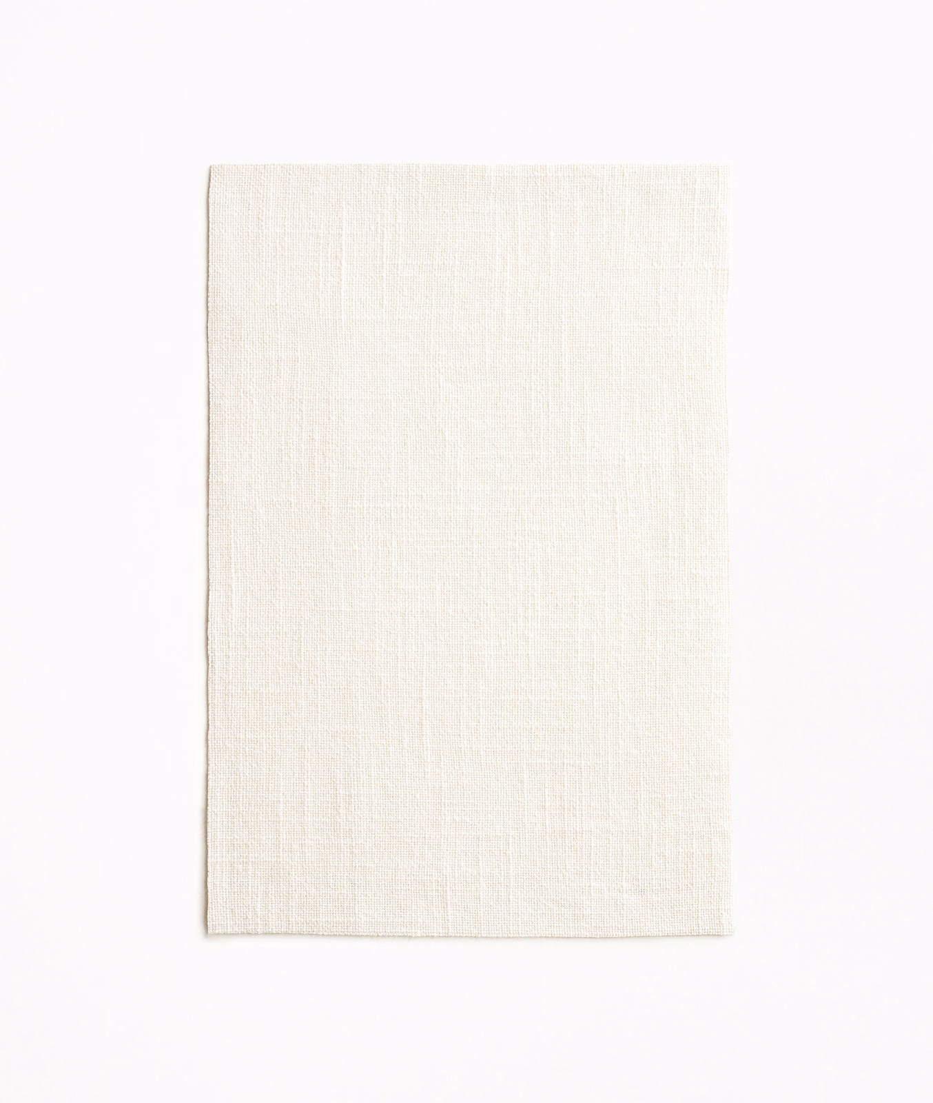 Soft ivory sheer swatch showing a fine, lightly slubbed woven texture