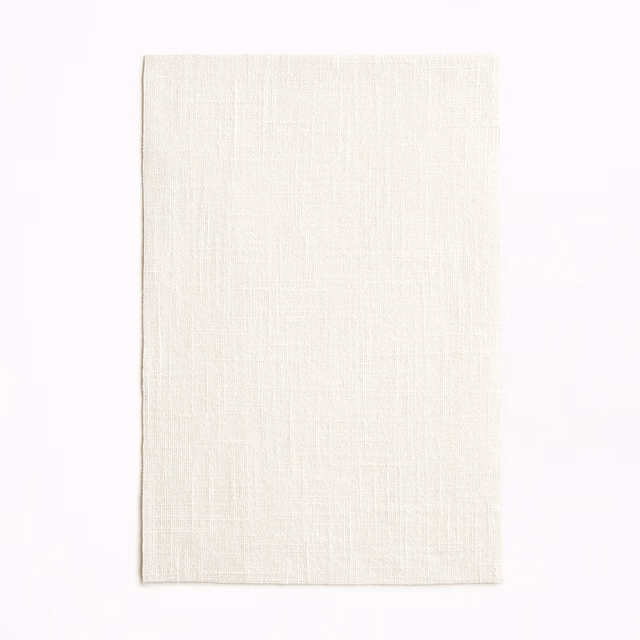 Soft ivory sheer swatch showing a fine, lightly slubbed woven texture