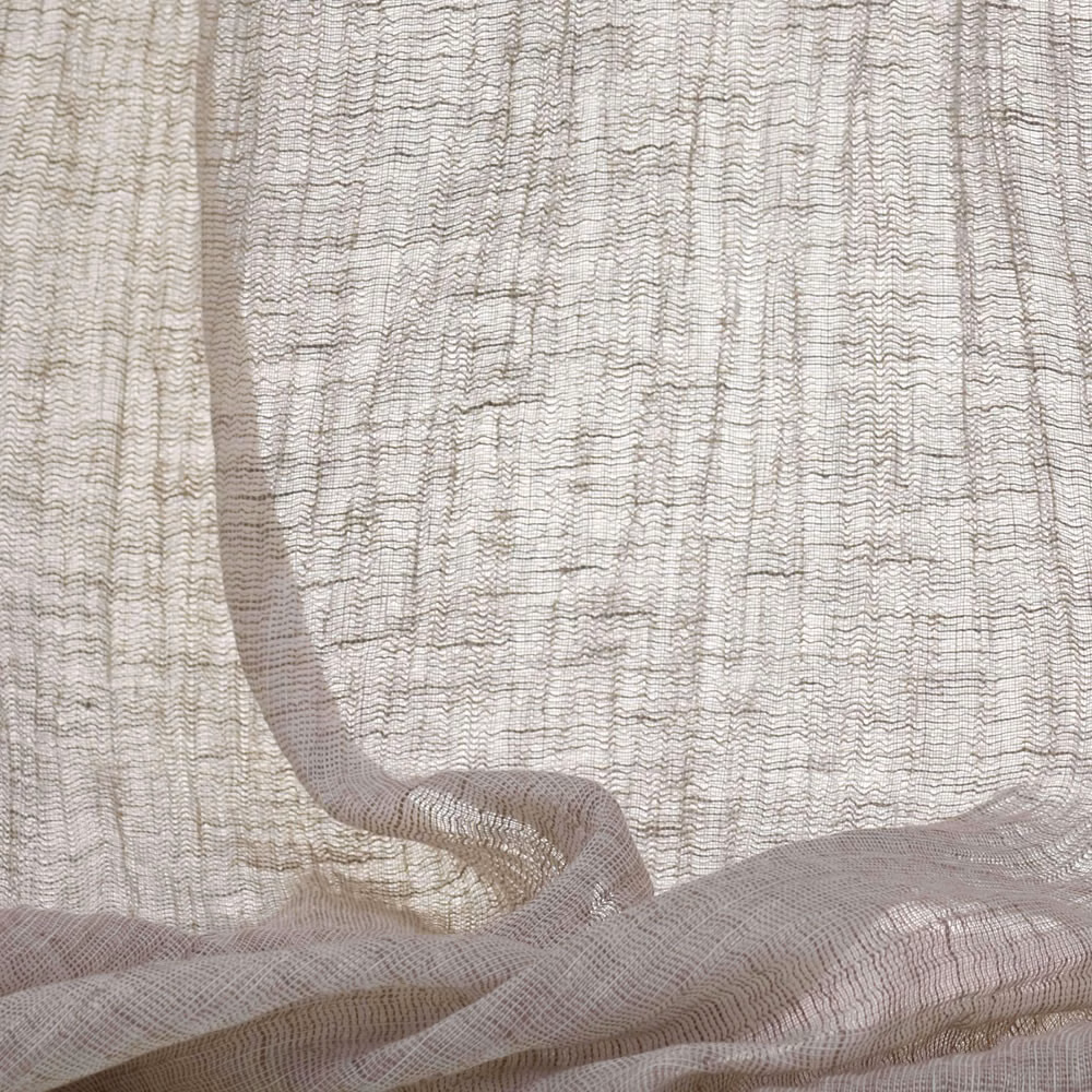 Pale greige sheer fabric with an open rippled weave gathered into soft translucent folds