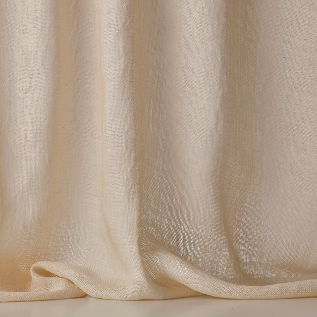 Warm ivory sheer fabric with an open gauze weave, softly gathered in vertical folds