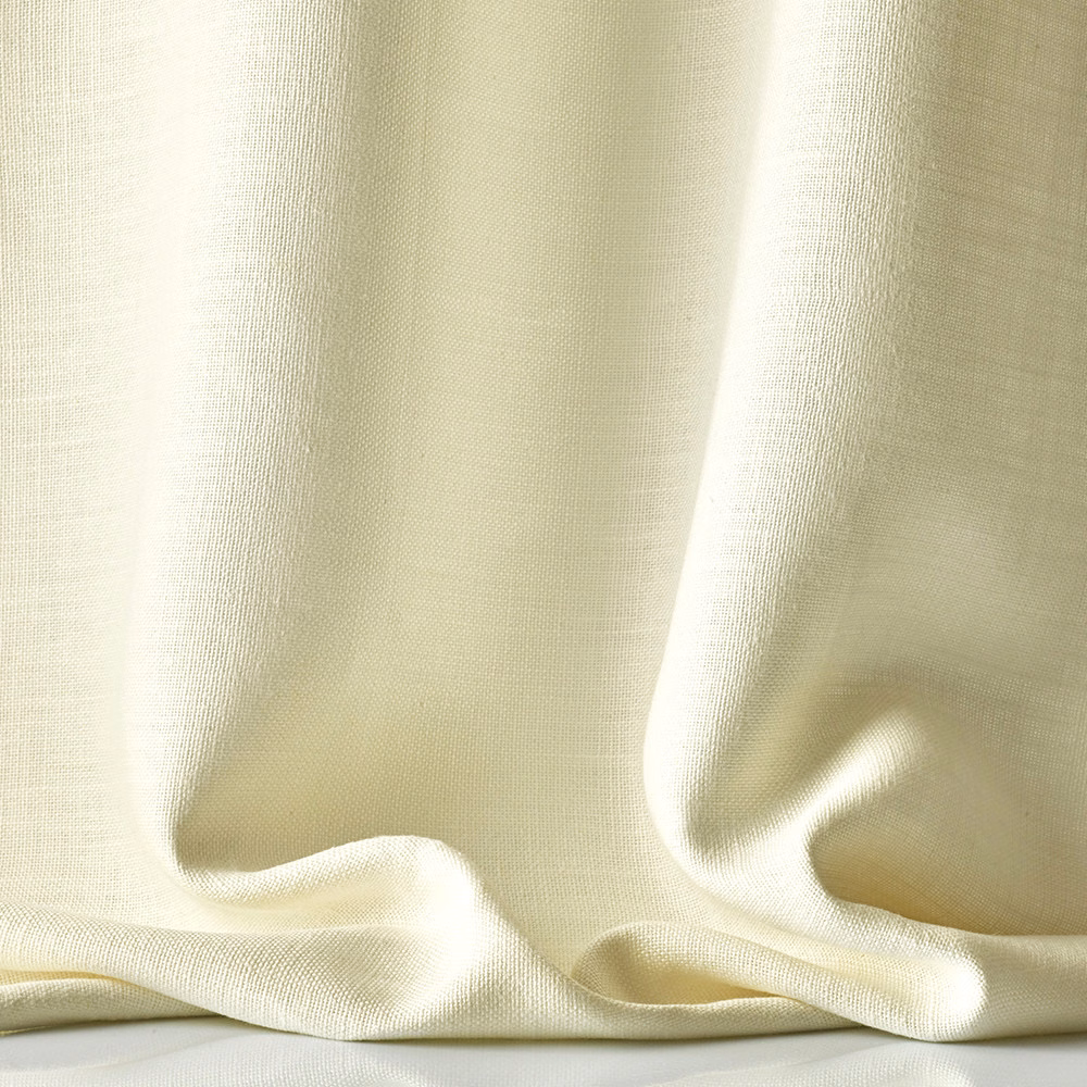 Warm ivory sheer linen with a fine weave falling into softly pooled folds