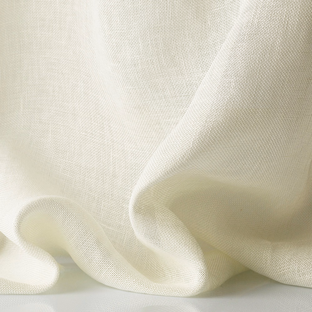 Warm ivory sheer fabric with fine open weave gathered into soft folds