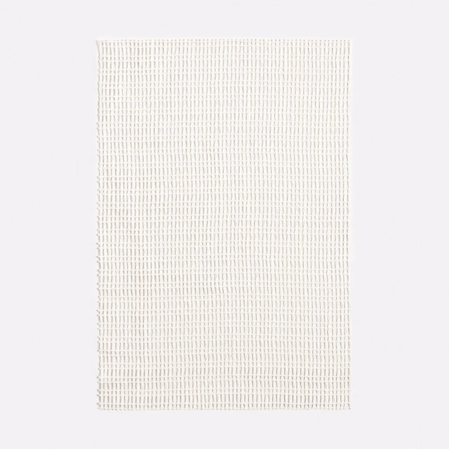Warm ivory sheer fabric with a fine, evenly spaced open-grid weave
