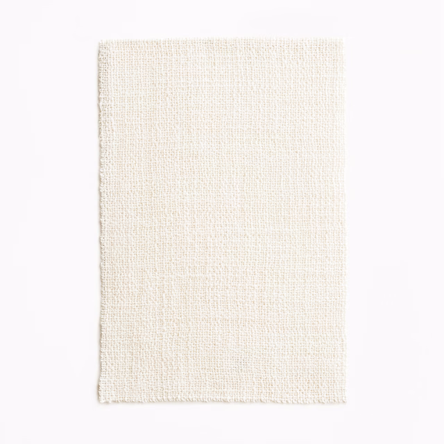 Warm ivory sheer swatch showing a fine, subtly irregular woven grid texture
