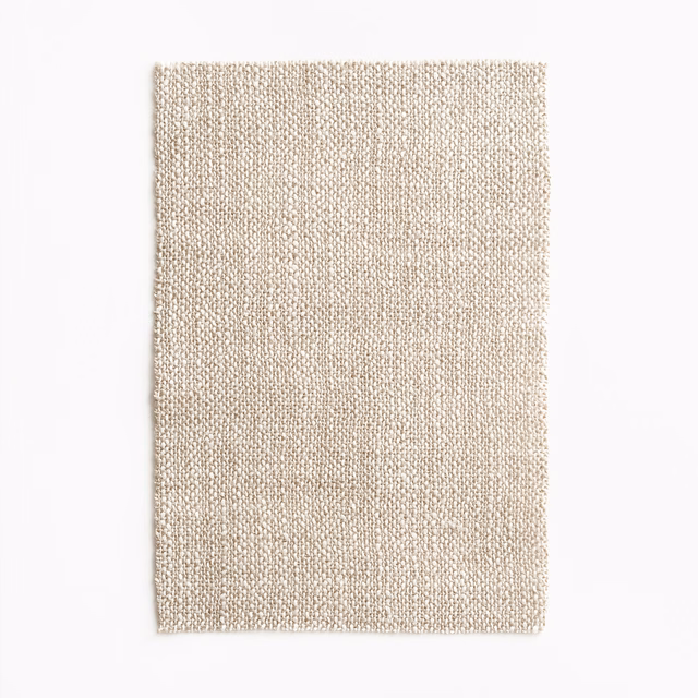 Pale oatmeal beige swatch showing a fine, subtly irregular woven texture