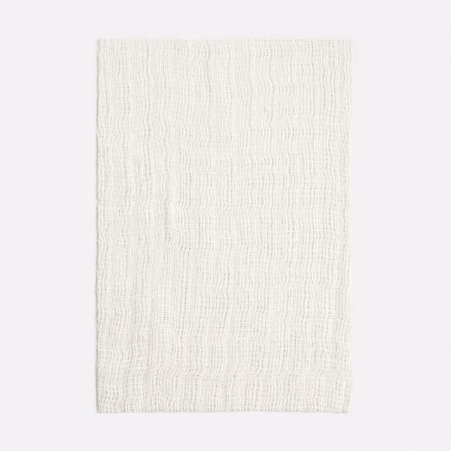 Ivory sheer swatch with fine irregular vertical waves and a lightly textured open weave