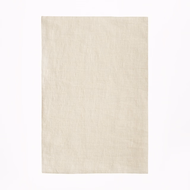 Warm ivory sheer linen with a softly crosshatched woven texture