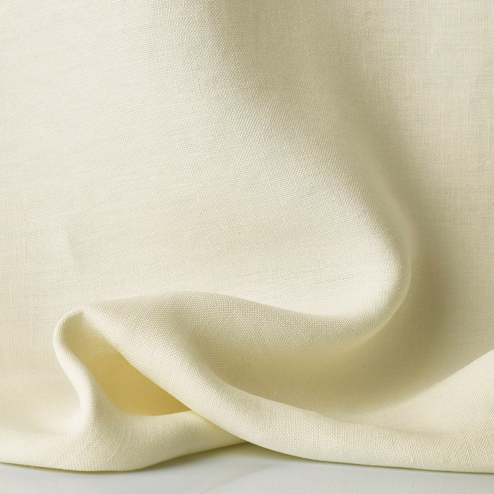 Warm ivory sheer weave gathered into soft, light-catching folds
