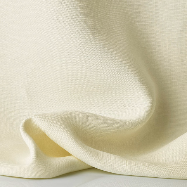 Warm ivory sheer weave gathered into soft, light-catching folds