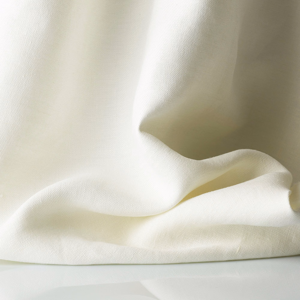 Warm ivory sheer weave gathered into soft, translucent folds
