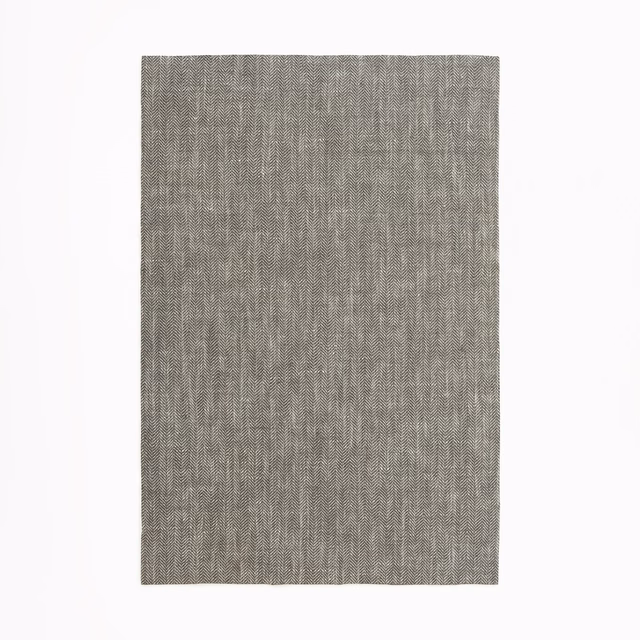 Charcoal-grey sheer fabric swatch with fine vertical woven texture
