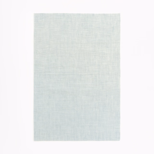 Pale glacier blue-grey sheer fabric with a fine linen-like crossweave texture