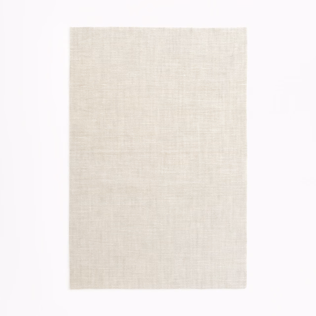 Pale mastic beige sheer swatch with a fine, subtly crosshatched woven texture