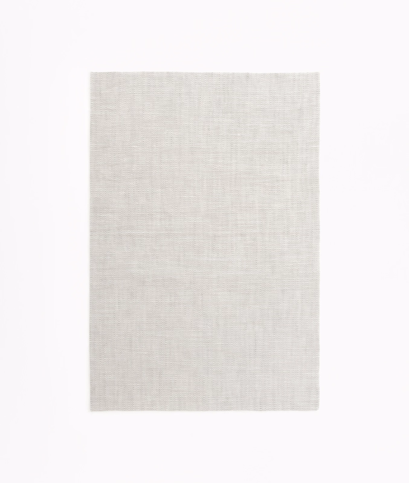 Pale pearl-grey sheer swatch showing a fine, lightly gridded woven texture