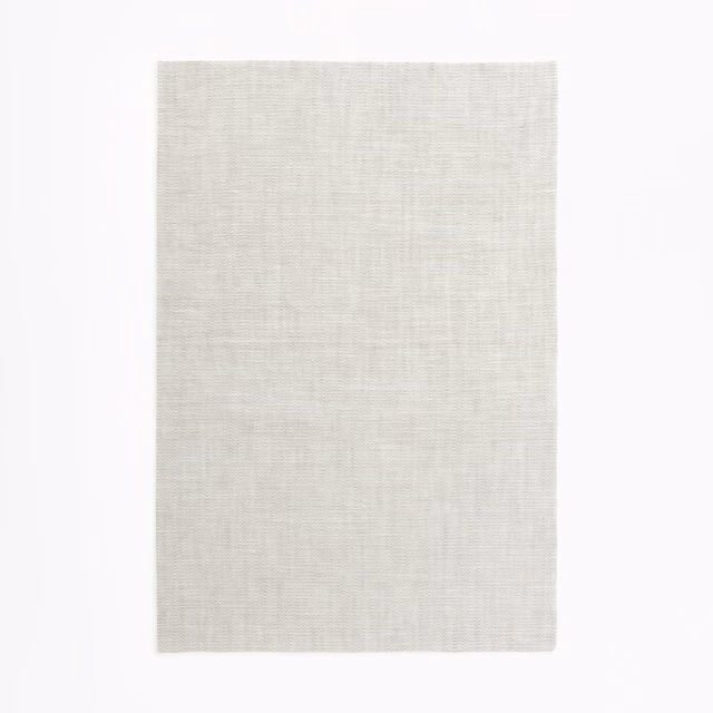 Pale pearl-grey sheer swatch showing a fine, lightly gridded woven texture