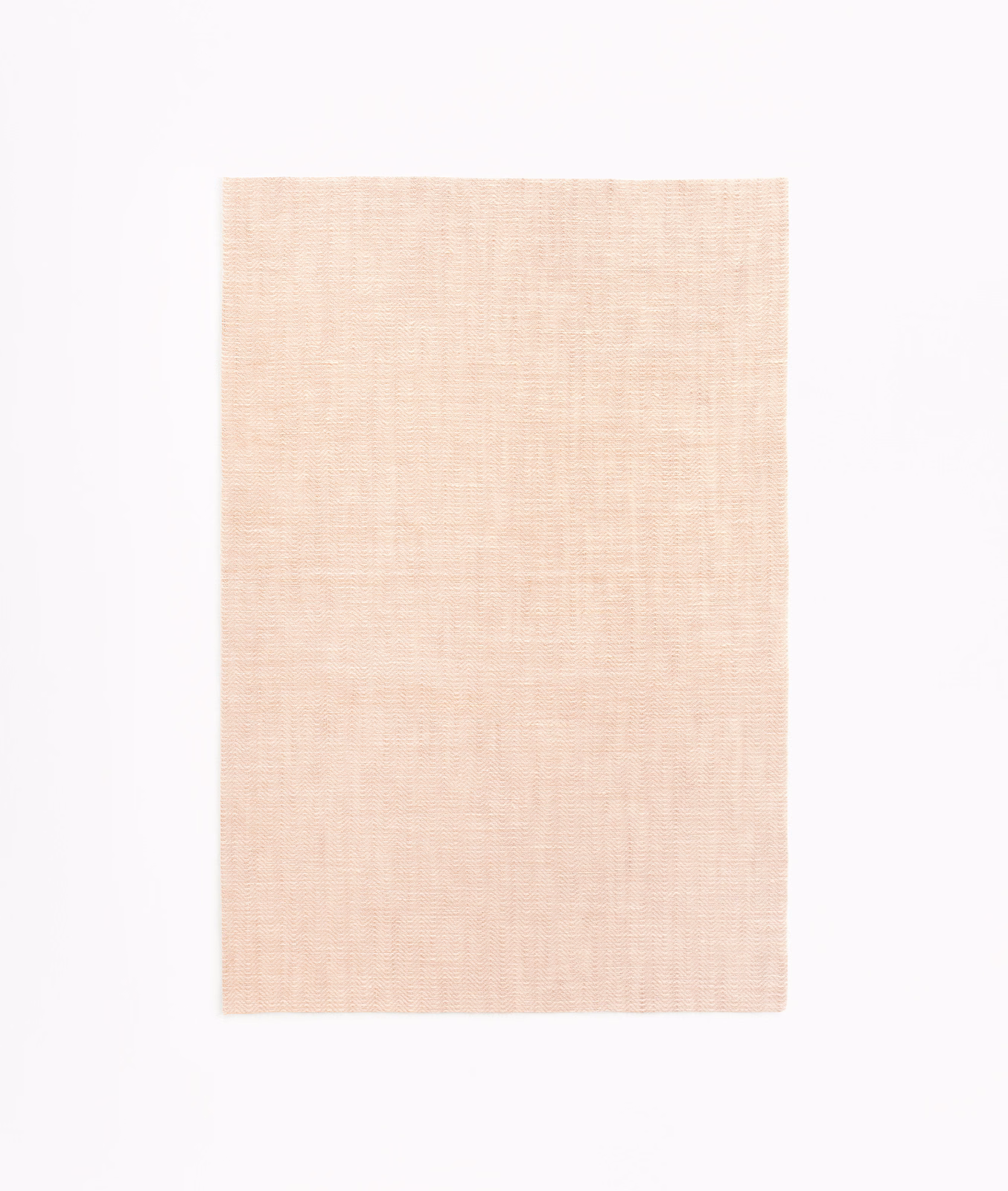 Pale blush-pink sheer fabric swatch with a fine, softly crosshatched weave