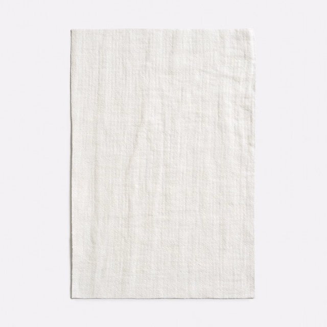 Soft ivory sheer with a fine irregular linen-textured weave and subtle vertical slubs