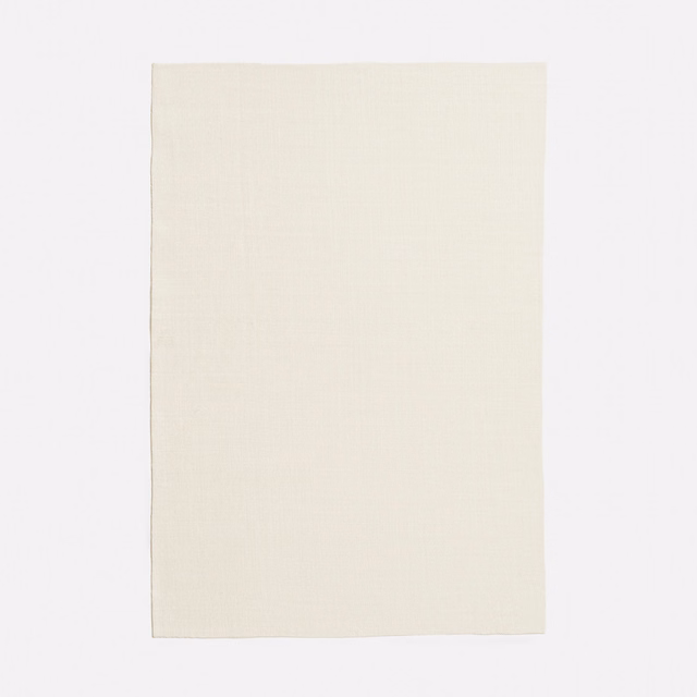 Near-white ivory sheer swatch showing a delicate, subtly grained woven surface