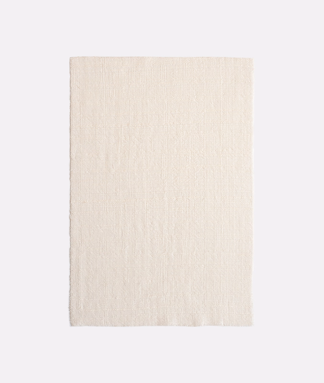Pale ivory sheer fabric with fine vertical slub texture in close-up