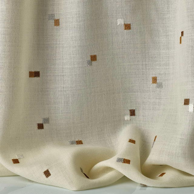 Translucent ivory sheer with scattered rust-brown, grey and white square flecks