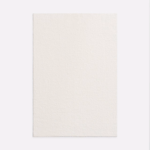 Warm ivory plain-weave swatch with a fine, softly irregular surface