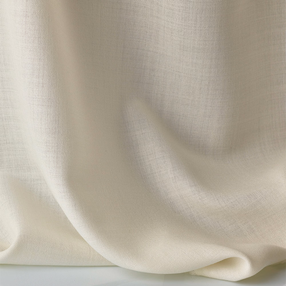 Warm ivory sheer fabric with fine weave draped in softly rounded folds