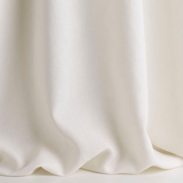 Soft natural ivory sheer cloth falling in broad, fluid folds