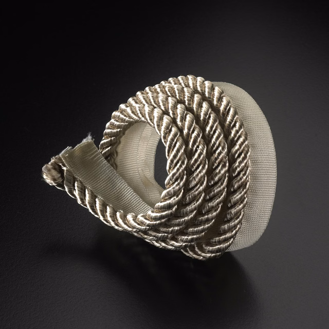 Warm ivory-beige twisted lipcord with ribbed tape and sculptural spiral texture