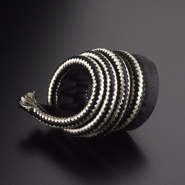 Black and ivory chevron lipcord coiled to show its rounded braided profile