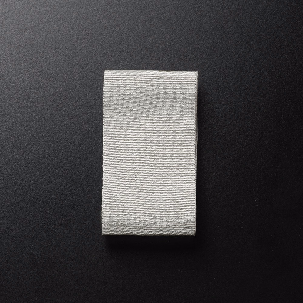 Silvery-grey fabric swatch with fine horizontal ribbed lines and subtle texture