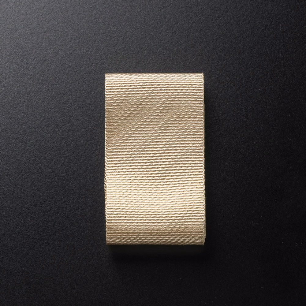 Warm cream textile swatch with fine beige-brown horizontal ribbing and subtle texture